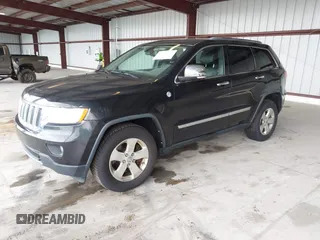 2012 Jeep Grand Cherokee Limited z VIN 1C4RJFBT1CC312006, wystawiony jako IAAI lot #42247170 z przebiegiem 233 890 mil mil oraz . Historia ofert i sprzedaży dostępna na DreamBid. Obrazek 17.