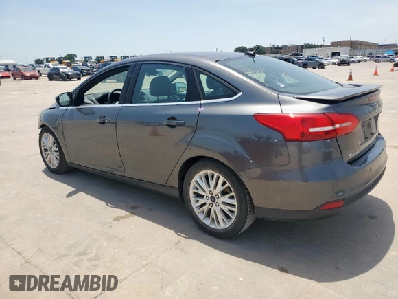 2017 Ford Focus Titanium with VIN 1FADP3J20HL253446, listed as a Copart auction lot 64196895 with 150,633 mi miles and Salvage title. Bid and sale history available at DreamBid. Image 2.