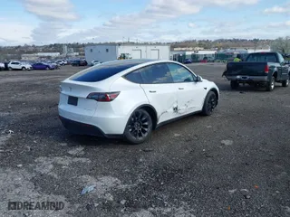 2023 Tesla Model Y Long Range with VIN 7SAYGDEE2PA059668, listed as a IAAI auction lot 41901079 with 58,276 mi miles. Bid and sale history available at carsss.com. Image 4.