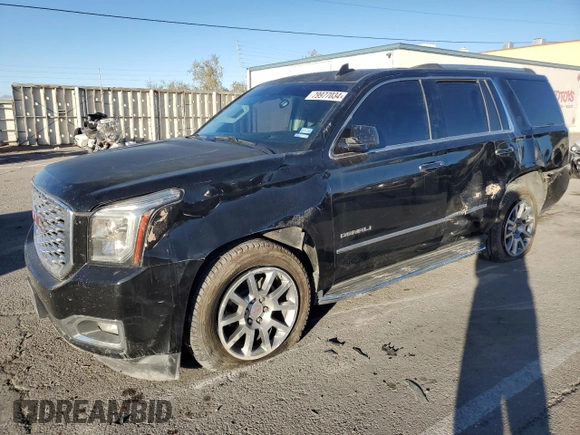 2018 GMC Yukon Denali with VIN 1GKS1CKJ0JR106589, listed as a Copart auction lot 79977034 with 98,022 mi miles and Salvage Title. Bid and sale history available at carsss.com. Image 1.