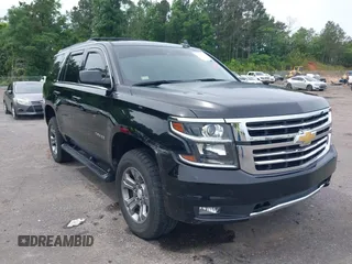 2017 Chevrolet Tahoe LT z VIN 1GNSKBKC8HR311969, wystawiony jako IAAI lot #42126414 z przebiegiem 160 994 mil mil oraz . Historia ofert i sprzedaży dostępna na DreamBid. Obrazek 1.