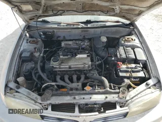 2001 Mitsubishi Mirage ES z VIN JA3AY26CX1U030593, wystawiony jako Copart lot #83749264 z przebiegiem 107 641 mil mil oraz Szkoda całkowita • Salvage title. Historia ofert i sprzedaży dostępna na DreamBid. Obrazek 11.