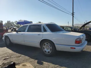 2001 Jaguar XJ VDP with VIN SAJDA24C11LF28715, listed as a Copart auction lot 65246334 with 107,965 mi miles and Salvage Title. Bid and sale history available at carsss.com. Image 2.