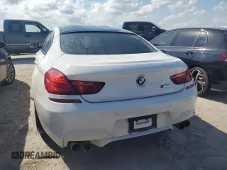 2016 BMW M6 z VIN WBS6E9C55GGF92676, wystawiony jako Copart lot #77663924 z przebiegiem 36 548 mil mil oraz Szkoda całkowita • Salvage title. Historia ofert i sprzedaży dostępna na DreamBid. Obrazek 6.