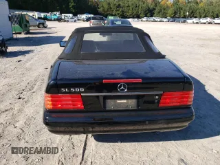 1997 Mercedes-Benz SL-Class with VIN WDBFA67F9VF146887, listed as a Copart auction lot 77166464 with 0 mi miles and Salvage Title. Bid and sale history available at carsss.com. Image 6.