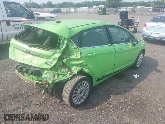2014 Ford Fiesta Titanium z VIN 3FADP4FJXEM226724, wystawiony jako IAAI lot #42427106 z przebiegiem 63 302 mil mil oraz . Historia ofert i sprzedaży dostępna na DreamBid. Obrazek 4.