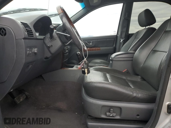 2003 Kia Sorento LX z VIN KNDJC733335030322, wystawiony jako Copart lot #77607974 z przebiegiem 109 777 mil mil oraz Szkoda całkowita • Salvage title. Historia ofert i sprzedaży dostępna na DreamBid. Obrazek 7.