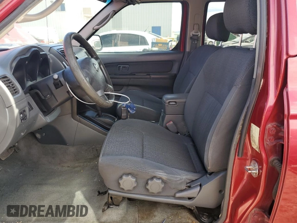 2003 Nissan Frontier XE with VIN 1N6ED27T13C409632, listed as a Copart auction lot 84884434 with 194,167 mi miles and Salvage title. Bid and sale history available at DreamBid. Image 7.