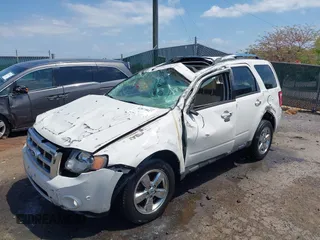 2011 Ford Escape Limited with VIN 1FMCU9EG5BKB08855, listed as a IAAI auction lot 42073027 with 145,471 mi miles and . Bid and sale history available at DreamBid. Image 2.