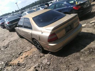 1994 Honda Accord LX with VIN 1HGCD5636RA020200, listed as a IAAI auction lot 40056997 with 212,810 mi miles. Bid and sale history available at carsss.com. Image 3.