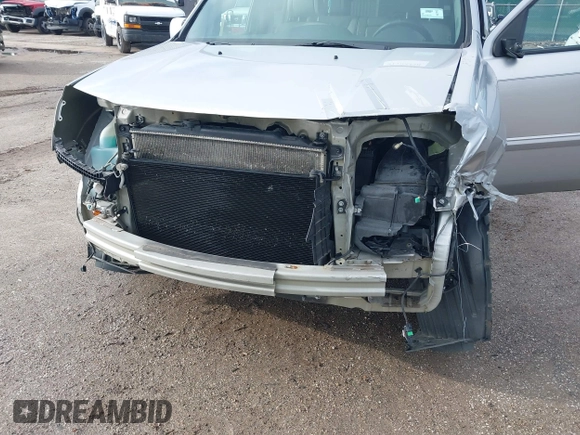 2013 Honda Pilot EX-L with VIN 5FNYF3H76DB013332, listed as a IAAI auction lot 41193240 with 121,308 mi miles and . Bid and sale history available at DreamBid. Image 6.