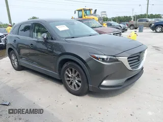 2019 Mazda CX-9 Touring z VIN JM3TCACY9K0308810, wystawiony jako IAAI lot #42336707 z przebiegiem 87 157 mil mil oraz . Historia ofert i sprzedaży dostępna na DreamBid. Obrazek 1.