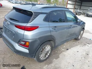 2021 Hyundai Kona SEL with VIN KM8K22AA5MU655335, listed as a IAAI auction lot 41464402 with 74,384 mi miles. Bid and sale history available at carsss.com. Image 4.