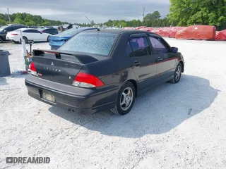 2002 Mitsubishi Lancer OZ-Rally with VIN JA3AJ86E22U074890, listed as a IAAI auction lot 42029591 with 235,818 mi miles. Bid and sale history available at carsss.com. Image 4.