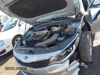 2016 Kia Optima LX with VIN 5XXGT4L34GG078857, listed as a IAAI auction lot 41819971 with 112,963 mi miles. Bid and sale history available at carsss.com. Image 10.