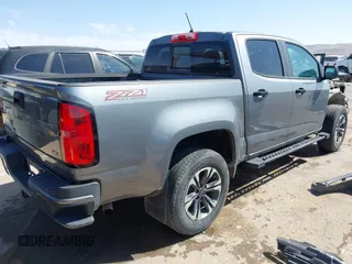 2021 Chevrolet Colorado 4WD Z71 z VIN 1GCGTDEN7M1117558, wystawiony jako IAAI lot #41911673 z przebiegiem 51 838 mil mil oraz . Historia ofert i sprzedaży dostępna na DreamBid. Obrazek 4.