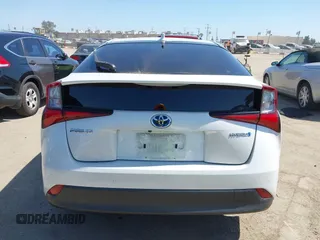 2021 Toyota Prius L Eco with VIN JTDKAMFU8M3135142, listed as a IAAI auction lot 42317007 with 77,353 mi miles and . Bid and sale history available at DreamBid. Image 16.