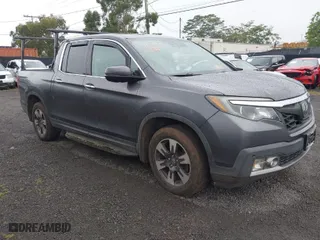 2017 Honda Ridgeline RTL-E with VIN 5FPYK3F76HB034774, listed as a IAAI auction lot 41754824 with 67,451 mi miles. Bid and sale history available at carsss.com. Image 1.