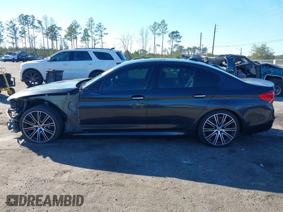 2018 BMW 5 Series M550i xDrive with VIN WBAJB9C57JG463933, listed as a IAAI auction lot 41295711 with 99,173 mi miles and . Bid and sale history available at carsss.com. Image 14.