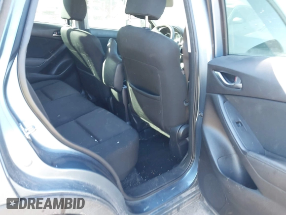 2016 Mazda CX-5 Sport with VIN JM3KE2BY3G0641895, listed as a IAAI auction lot 41689138 with 121,636 mi miles and . Bid and sale history available at DreamBid. Image 8.