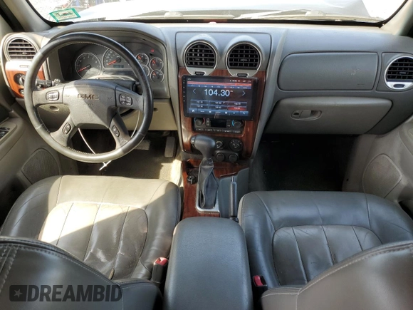 2003 GMC Envoy SLT z VIN 1GKET16PX36243554, wystawiony jako Copart lot #49083975 z przebiegiem 148 596 mil mil oraz Szkoda całkowita • Salvage title. Historia ofert i sprzedaży dostępna na DreamBid. Obrazek 8.