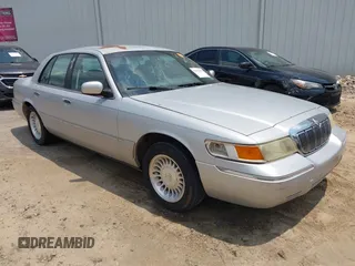 2002 Mercury Grand Marquis LS Premium z VIN 2MEFM75W82X657698, wystawiony jako IAAI lot #42410199 z przebiegiem 266 833 mil mil oraz . Historia ofert i sprzedaży dostępna na DreamBid. Obrazek 1.