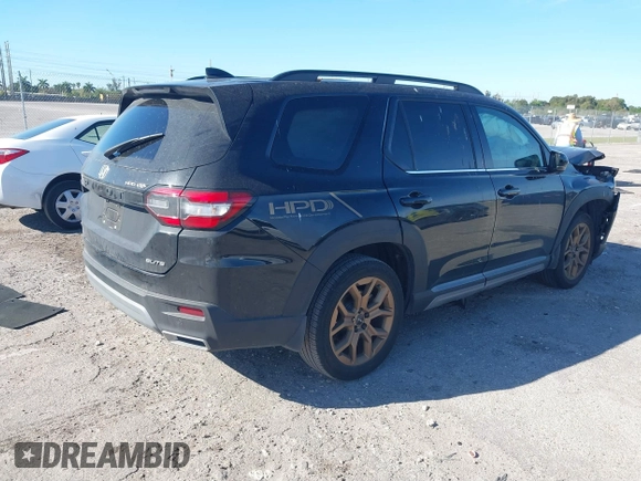 2023 Honda Pilot Elite with VIN 5FNYG1H87PB045057, listed as a IAAI auction lot 41748553 with 44,329 mi miles and . Bid and sale history available at DreamBid. Image 4.