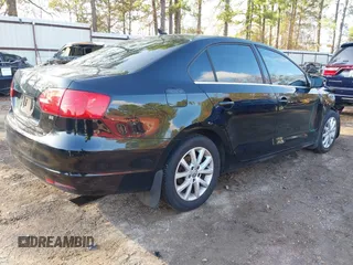 2014 Volkswagen Jetta Sedan SE w/Connectivity with VIN 3VWD07AJ8EM427848, listed as a IAAI auction lot 40988647 with 134,773 mi miles. Bid and sale history available at carsss.com. Image 4.