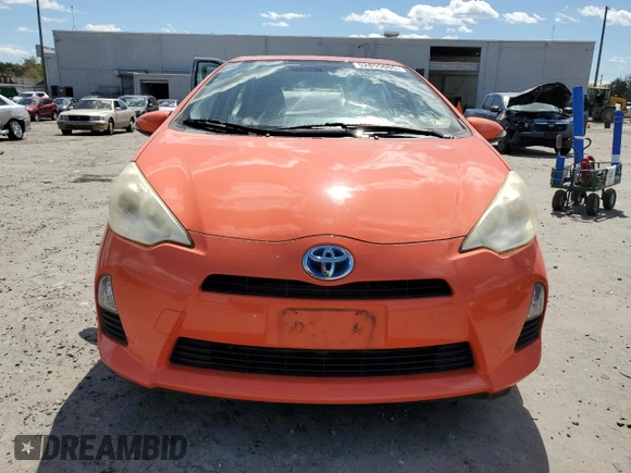 2012 Toyota Prius c One with VIN JTDKDTB35C1030051, listed as a Copart auction lot 52895065 with 94,529 mi miles and Salvage Title. Bid and sale history available at carsss.com. Image 5.