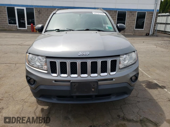 2012 Jeep Compass Latitude with VIN 1C4NJDEB0CD621109, listed as a Copart auction lot 54737735 with 73,323 mi miles and Salvage Title. Bid and sale history available at DreamBid. Image 5.