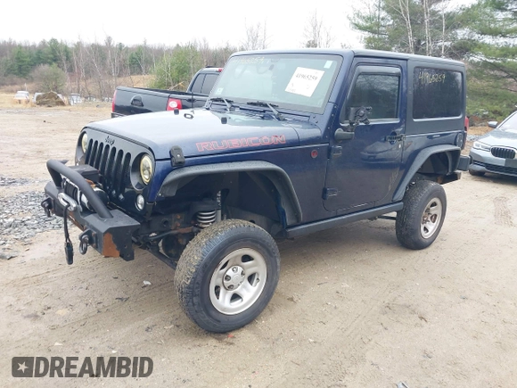 2013 Jeep Wrangler Rubicon 10th Anniversary with VIN 1C4BJWCG7DL544145, listed as a IAAI auction lot 41965259 with 125,900 mi miles and . Bid and sale history available at carsss.com. Image 2.