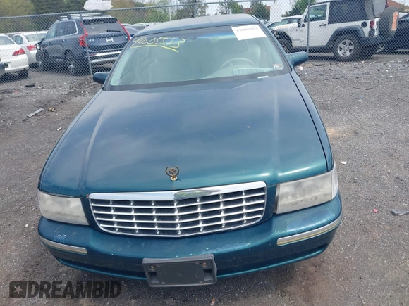 1999 Cadillac DeVille DHS z VIN 1G6KE54Y9XU766791, wystawiony jako IAAI lot #42005553 z przebiegiem 140 515 mil mil oraz . Historia ofert i sprzedaży dostępna na DreamBid. Obrazek 6.