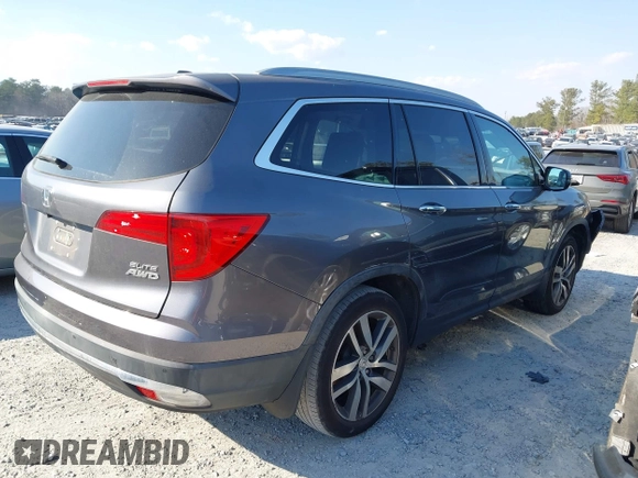 2016 Honda Pilot Elite with VIN 5FNYF6H01GB050555, listed as a IAAI auction lot 41670197 with 140,000 mi miles. Bid and sale history available at carsss.com. Image 4.