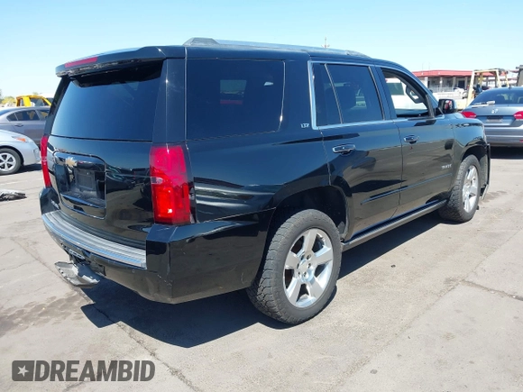 2015 Chevrolet Tahoe LTZ z VIN 1GNSKCKC7FR715512, wystawiony jako IAAI lot #42054583 z przebiegiem 106 941 mil mil oraz . Historia ofert i sprzedaży dostępna na DreamBid. Obrazek 4.