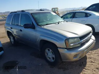 2003 Chevrolet TrailBlazer LS with VIN 1GNDT13SX32271126, listed as a IAAI auction lot 41760397 with 242,715 mi miles. Bid and sale history available at carsss.com. Image 1.