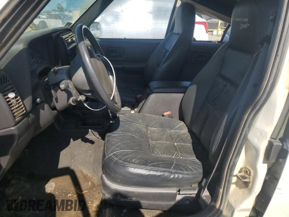 1999 Jeep Cherokee Sport z VIN 1J4FF68S3XL597049, wystawiony jako Copart lot #58736325 z przebiegiem 134 684 mil mil oraz Nie do naprawy • Non repairable. Historia ofert i sprzedaży dostępna na DreamBid. Obrazek 7.