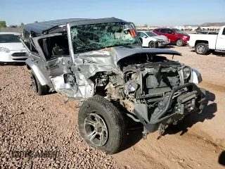2015 Jeep Wrangler Unlimited Sahara z VIN 1C4BJWEG1FL617428, wystawiony jako Copart lot #55850005 z przebiegiem Nie podano mil oraz Szkoda całkowita • Salvage title. Historia ofert i sprzedaży dostępna na DreamBid. Obrazek 13.