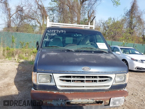 2002 Ford Econoline Cargo with VIN 1FTRE142X2HA67221, listed as a IAAI auction lot 42079493 with 180,324 mi miles. Bid and sale history available at carsss.com. Image 6.