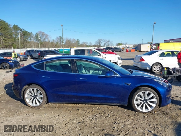 2019 Tesla Model 3 Long Range with VIN 5YJ3E1EB7KF454636, listed as a IAAI auction lot 41853972 with 56,916 mi miles. Bid and sale history available at carsss.com. Image 14.