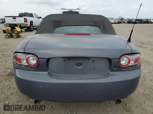 2007 Mazda MX-5 Miata Sport z VIN JM1NC25F970134960, wystawiony jako Copart lot #48422265 z przebiegiem 149 357 mil mil oraz Czysty tytuł • Clean title. Historia ofert i sprzedaży dostępna na DreamBid. Obrazek 6.