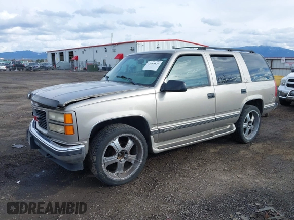 1999 GMC Yukon with VIN 1GKEK13R2XJ712390, listed as a IAAI auction lot 41793649 with 222,721 mi miles. Bid and sale history available at carsss.com. Image 18.