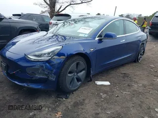 2020 Tesla Model 3 Standard Range Plus with VIN 5YJ3E1EA1LF658521, listed as a IAAI auction lot 41804722 with 83,248 mi miles and . Bid and sale history available at DreamBid. Image 2.