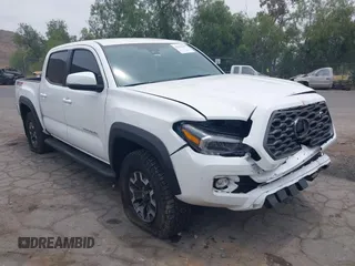 2023 Toyota Tacoma SR with VIN 3TMCZ5AN1PM556299, listed as a IAAI auction lot 42344160 with 42,338 mi miles and . Bid and sale history available at DreamBid. Image 1.