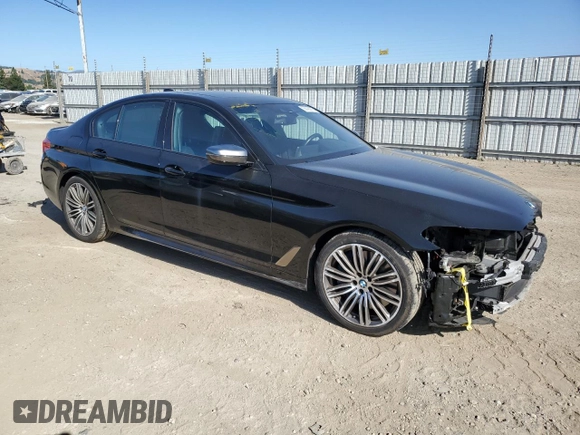 2019 BMW 5 Series M550i xDrive with VIN WBAJB9C50KB464503, listed as a Copart auction lot 56995825 with 67,324 mi miles and Salvage title. Bid and sale history available at DreamBid. Image 4.
