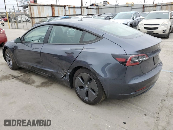 2023 Tesla Model 3 with VIN 5YJ3E1EA3PF697049, listed as a Copart auction lot 55601295 with 12,373 mi miles and Salvage Title. Bid and sale history available at DreamBid. Image 2.