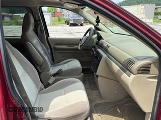2005 Ford Freestar SES с VIN 2FMZA57605BA82597, выставлен на аукционе Copart как лот 61200505 с пробегом 188 210 миль миль и Чистый • Clean title. История ставок и продаж доступна на DreamBid. Изображение 5.