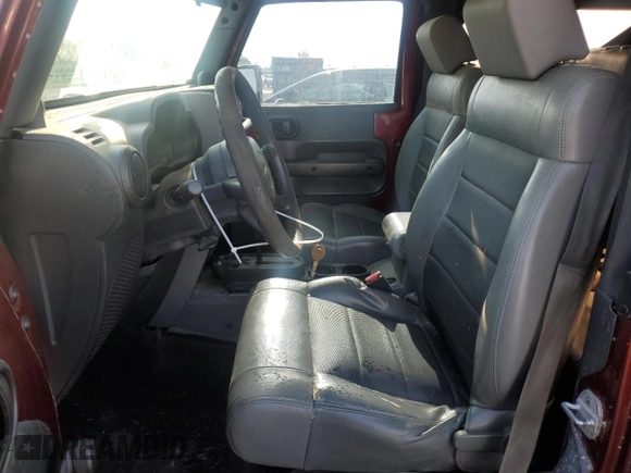 2009 Jeep Wrangler X with VIN 1J4FA24119L756089, listed as a Copart auction lot 56953205 with 158,157 mi miles and Salvage title. Bid and sale history available at DreamBid. Image 7.