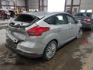 2018 Ford Focus Titanium with VIN 1FADP3N25JL261736, listed as a IAAI auction lot 41032128 with 59,142 mi miles and . Bid and sale history available at DreamBid. Image 4.