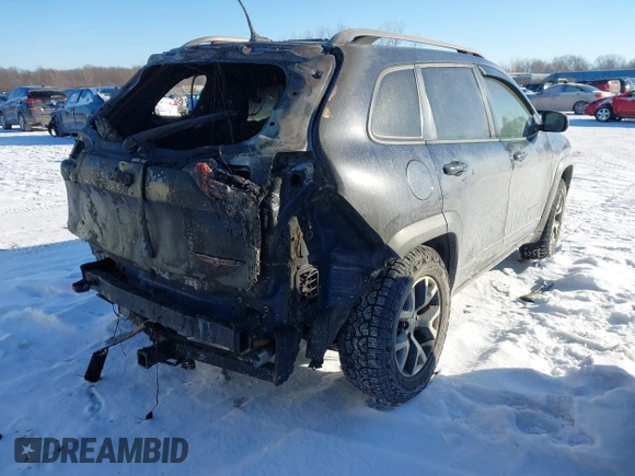 2014 Jeep Cherokee Trailhawk with VIN 1C4PJMBS8EW182259, listed as a IAAI auction lot 41309329 with Not Provided miles. Bid and sale history available at carsss.com. Image 4.
