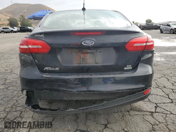 2018 Ford Focus SE with VIN 1FADP3FE8JL300246, listed as a Copart auction lot 59585035 with 83,141 mi miles and Salvage title. Bid and sale history available at DreamBid. Image 6.